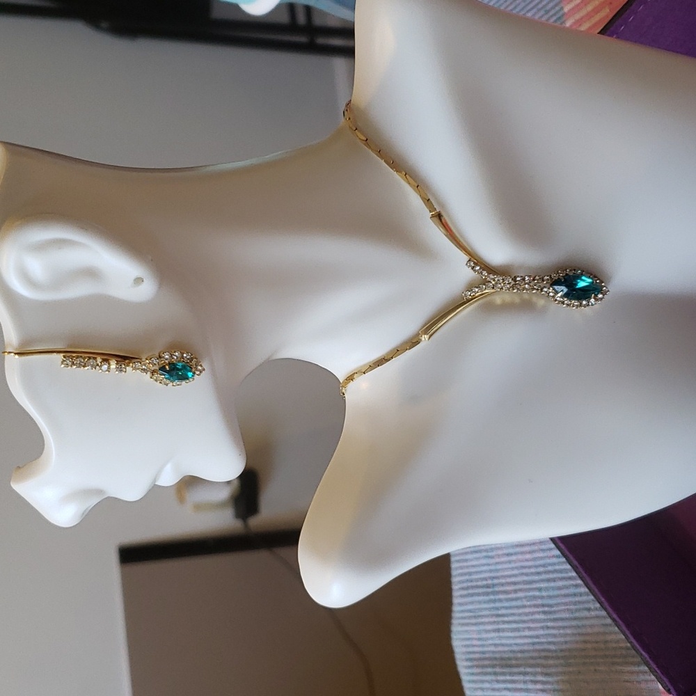 Teal rhinestone y necklace in gold tones featuring matching earrings